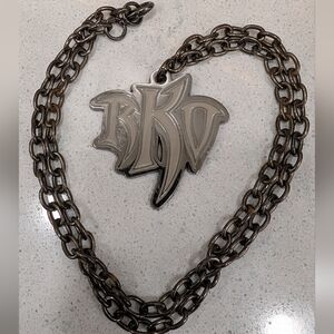 WWE Silver Tone And Gray Enamel RKO Pendant Necklace
